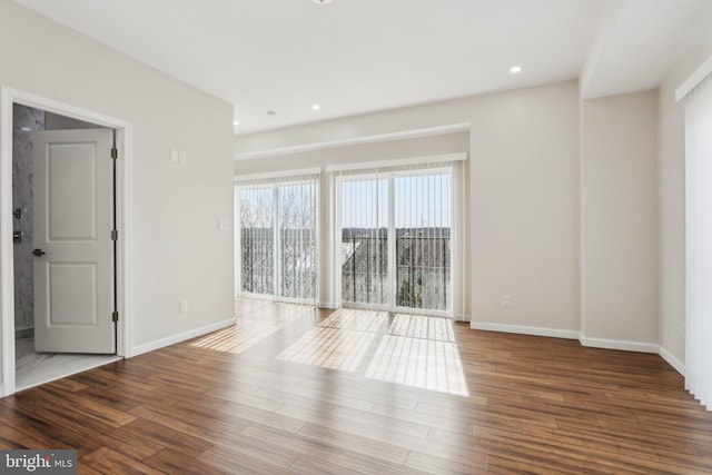 217 Grape St, Philadelphia, PA 19128 - spare room with baseboards, recessed lighting, and wood finished floors