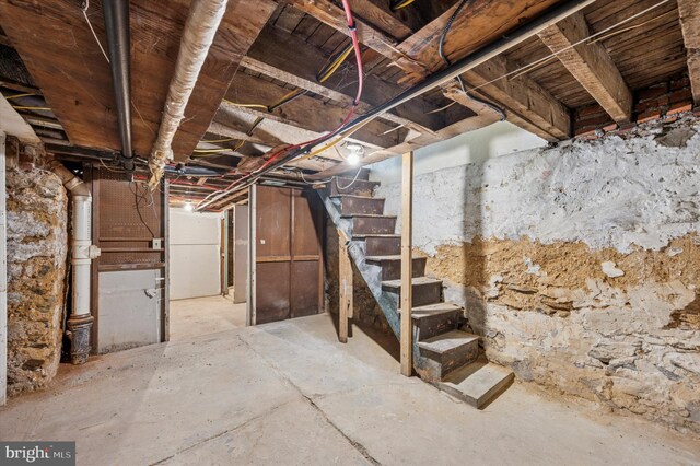 unfinished basement with stairs