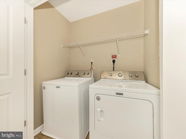 laundry area with washing machine and clothes dryer