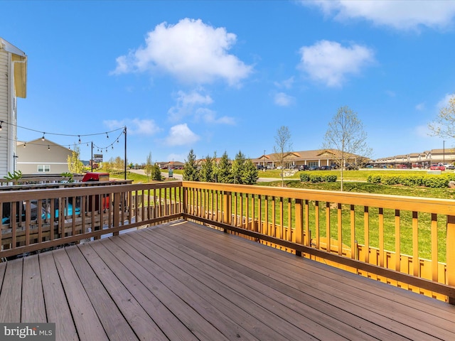 wooden deck with a residential view