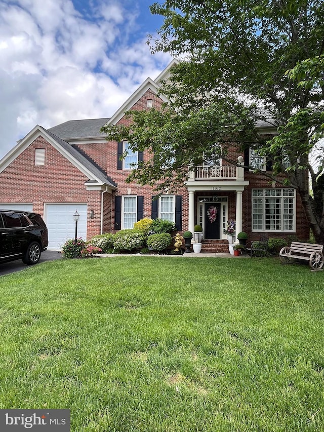 11162 Innsbrook Ct, Ijamsville, MD 21754 - georgian-style home featuring brick siding, a garage, a front yard, and asphalt driveway