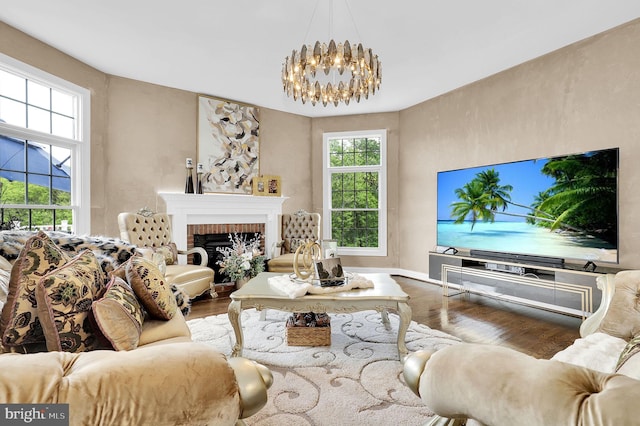 11162 Innsbrook Ct, Ijamsville, MD 21754 - living area with wood finished floors, a chandelier, and a brick fireplace