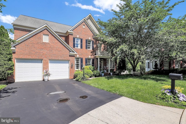 11162 Innsbrook Ct, Ijamsville, MD 21754 - view of front of home featuring brick siding, asphalt driveway, and a front lawn