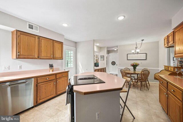 kitchen with dishwasher, brown cabinetry, and visible vents