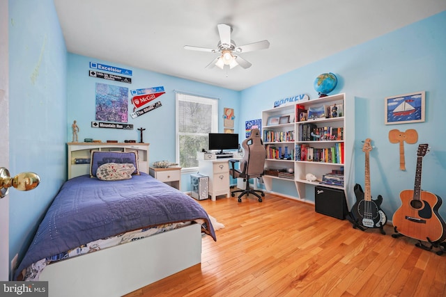 bedroom with ceiling fan and wood finished floors