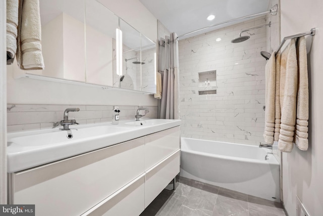 bathroom with recessed lighting, double vanity, a sink, and shower / tub combo with curtain
