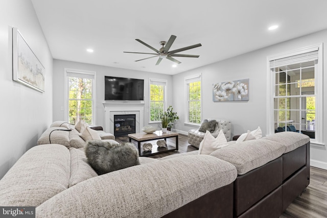 833 Gibbons Rd, Sykesville, MD 21784 - living area featuring baseboards, a ceiling fan, dark wood-style flooring, and a wealth of natural light
