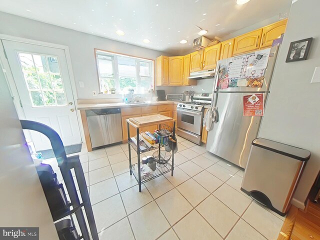 1231 S Clarion St, Philadelphia, PA 19147 - kitchen with appliances with stainless steel finishes, under cabinet range hood, light brown cabinetry, a sink, and recessed lighting