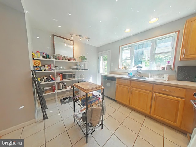 1231 S Clarion St, Philadelphia, PA 19147 - kitchen featuring appliances with stainless steel finishes, a sink, light tile patterned flooring, light countertops, and recessed lighting