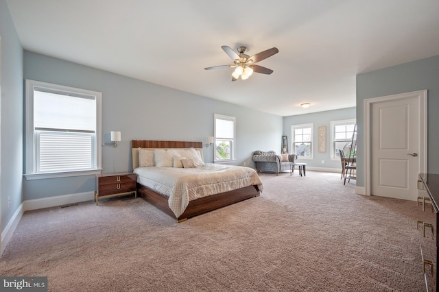 bedroom featuring baseboards, ceiling fan, carpet floors, and visible vents