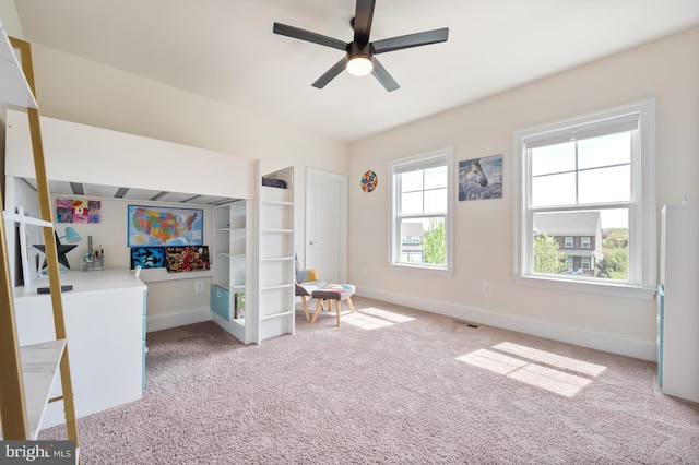 carpeted bedroom with baseboards, a ceiling fan, and visible vents