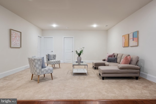 living room with baseboards and recessed lighting