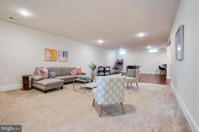 living area with carpet floors, baseboards, recessed lighting, and visible vents