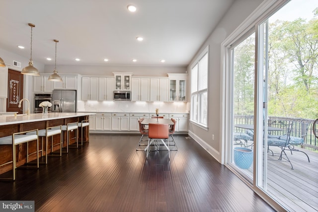 dining area featuring recessed lighting, dark wood-style floors, and visible vents
