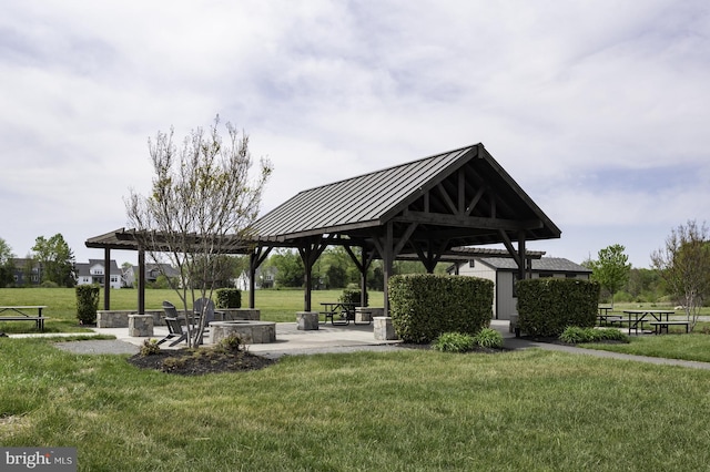 view of home's community with a yard, a gazebo, and a patio area