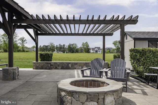 view of patio / terrace with a pergola and a fire pit