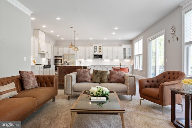 living room featuring light carpet and recessed lighting