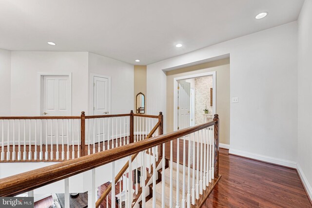 9192 Topaz St, Fairfax, VA 22031 - hallway featuring wood finished floors, an upstairs landing, baseboards, and recessed lighting
