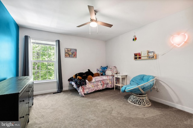 bedroom featuring baseboards, a ceiling fan, and carpet floors