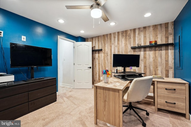office area with recessed lighting, light colored carpet, ceiling fan, baseboards, and wooden walls