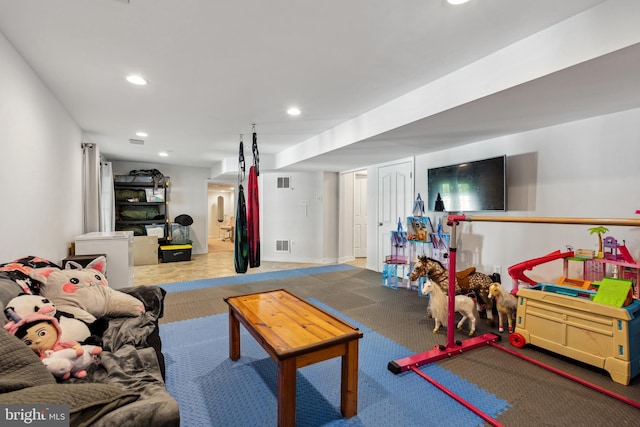 recreation room with recessed lighting and visible vents