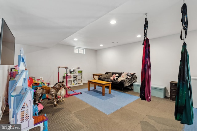 rec room with carpet and recessed lighting