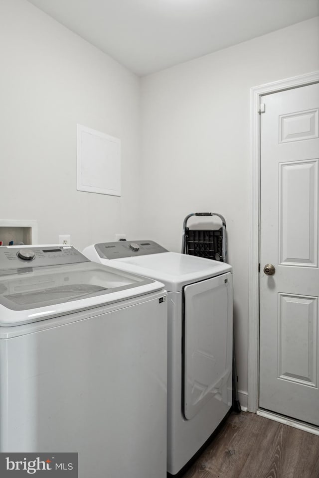 laundry room featuring washing machine and dryer, laundry area, and dark wood-type flooring