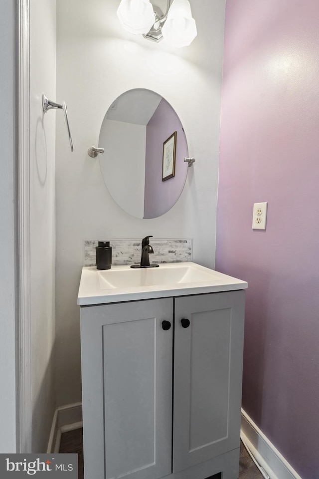 bathroom featuring vanity and baseboards