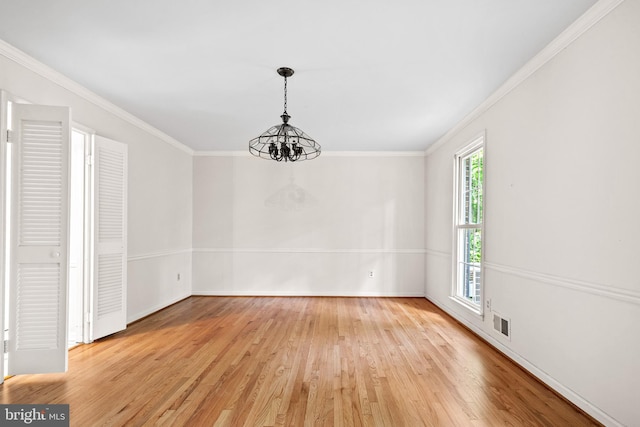 5420 Well Spring Rd, La Plata, MD 20646 - unfurnished dining area featuring crown molding, light wood-style floors, baseboards, and a chandelier