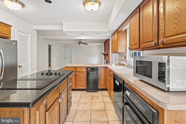 5420 Well Spring Rd, La Plata, MD 20646 - kitchen with black appliances, a sink, and brown cabinetry