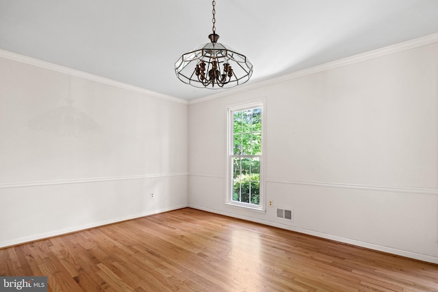 5420 Well Spring Rd, La Plata, MD 20646 - spare room featuring a chandelier, wood finished floors, baseboards, and ornamental molding