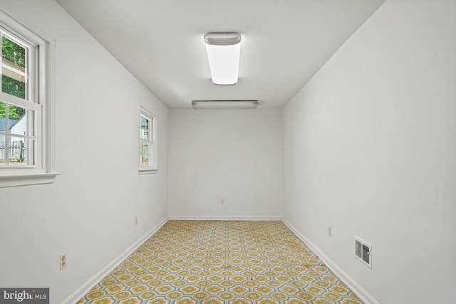 5420 Well Spring Rd, La Plata, MD 20646 - spare room featuring plenty of natural light, tile patterned floors, and baseboards