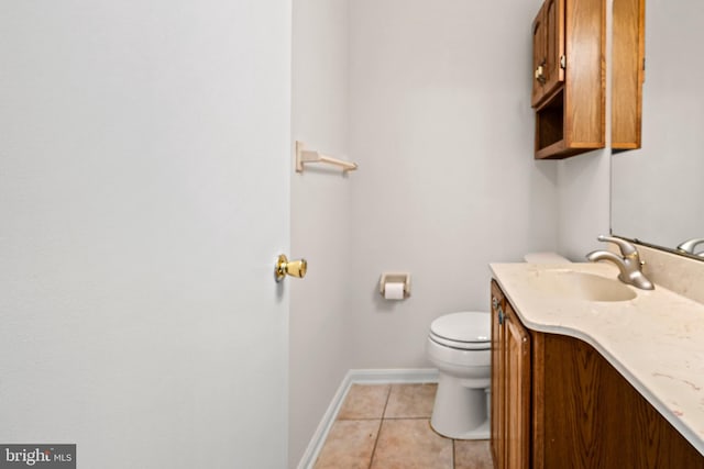 5420 Well Spring Rd, La Plata, MD 20646 - half bathroom featuring tile patterned floors, toilet, vanity, and baseboards