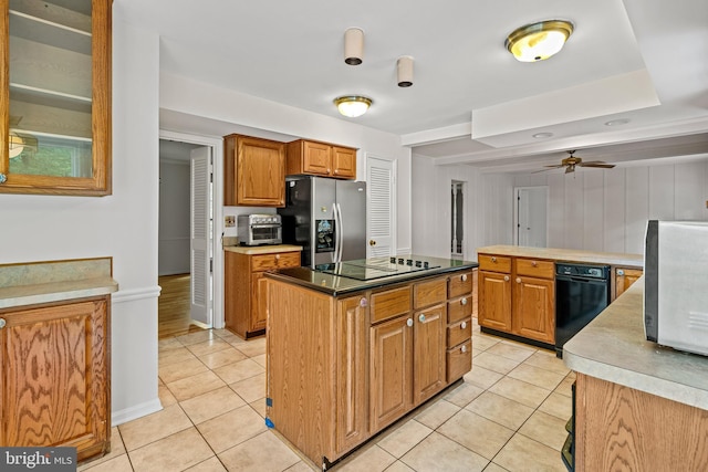 5420 Well Spring Rd, La Plata, MD 20646 - kitchen with stainless steel fridge, light tile patterned floors, brown cabinetry, a ceiling fan, and a kitchen island