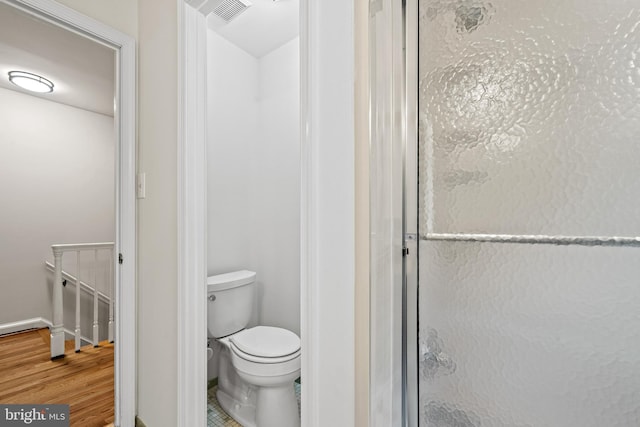 5420 Well Spring Rd, La Plata, MD 20646 - bathroom featuring toilet, wood finished floors, and baseboards