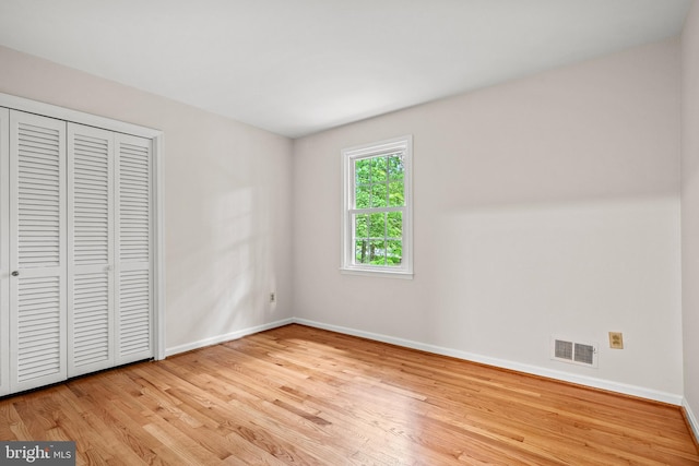 5420 Well Spring Rd, La Plata, MD 20646 - unfurnished bedroom with baseboards, wood finished floors, and a closet