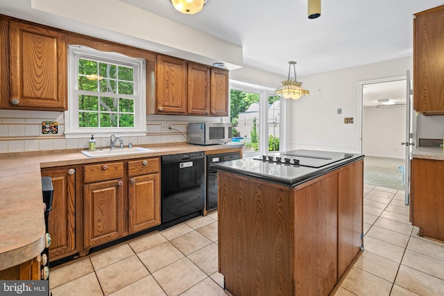 5420 Well Spring Rd, La Plata, MD 20646 - kitchen featuring black appliances, a sink, light tile patterned floors, and brown cabinets