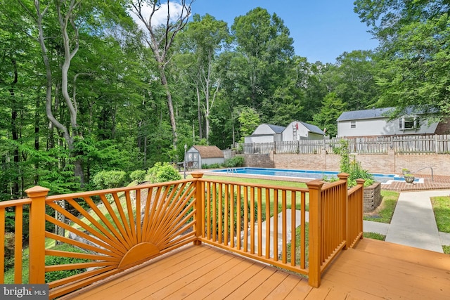 5420 Well Spring Rd, La Plata, MD 20646 - wooden deck featuring a fenced backyard, a storage shed, and an outbuilding