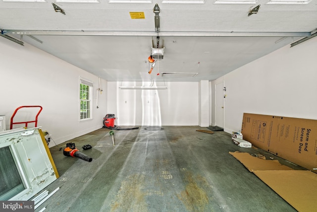 5420 Well Spring Rd, La Plata, MD 20646 - garage featuring a garage door opener and baseboards