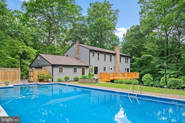 5420 Well Spring Rd, La Plata, MD 20646 - view of pool featuring a wooden deck and view of scattered trees