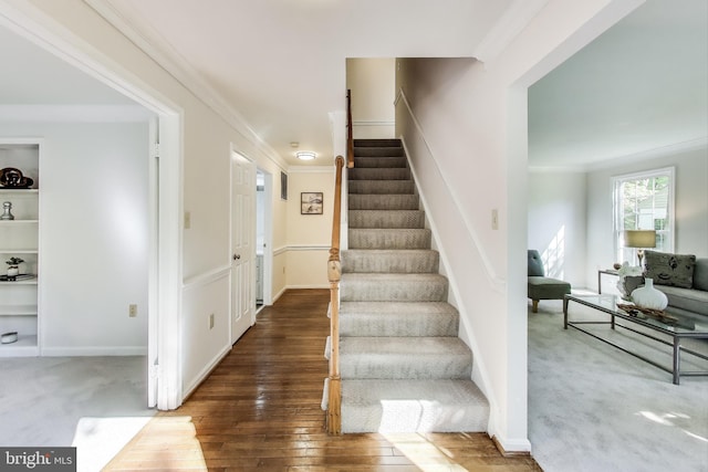 12148 Darnley Rd, Woodbridge, VA 22192 - stairs featuring crown molding and hardwood / wood-style flooring