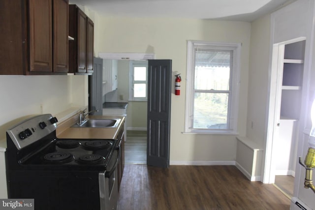 466 N Evans St, Pottstown, PA 19464 - kitchen with a sink, dark wood-style floors, baseboards, a baseboard heating unit, and electric range oven
