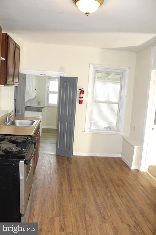 466 N Evans St, Pottstown, PA 19464 - kitchen with electric range oven, a sink, dark wood-style flooring, and baseboards