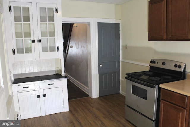 466 N Evans St, Pottstown, PA 19464 - kitchen featuring french doors, electric stove, glass insert cabinets, and dark wood-style floors