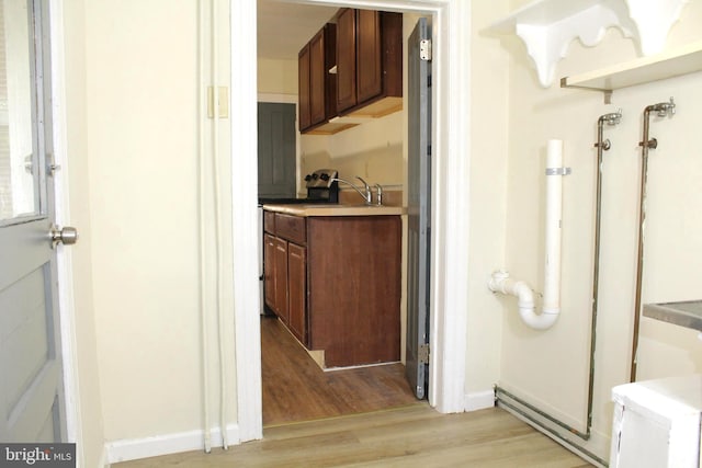 466 N Evans St, Pottstown, PA 19464 - bathroom featuring baseboards, wood finished floors, and a sink