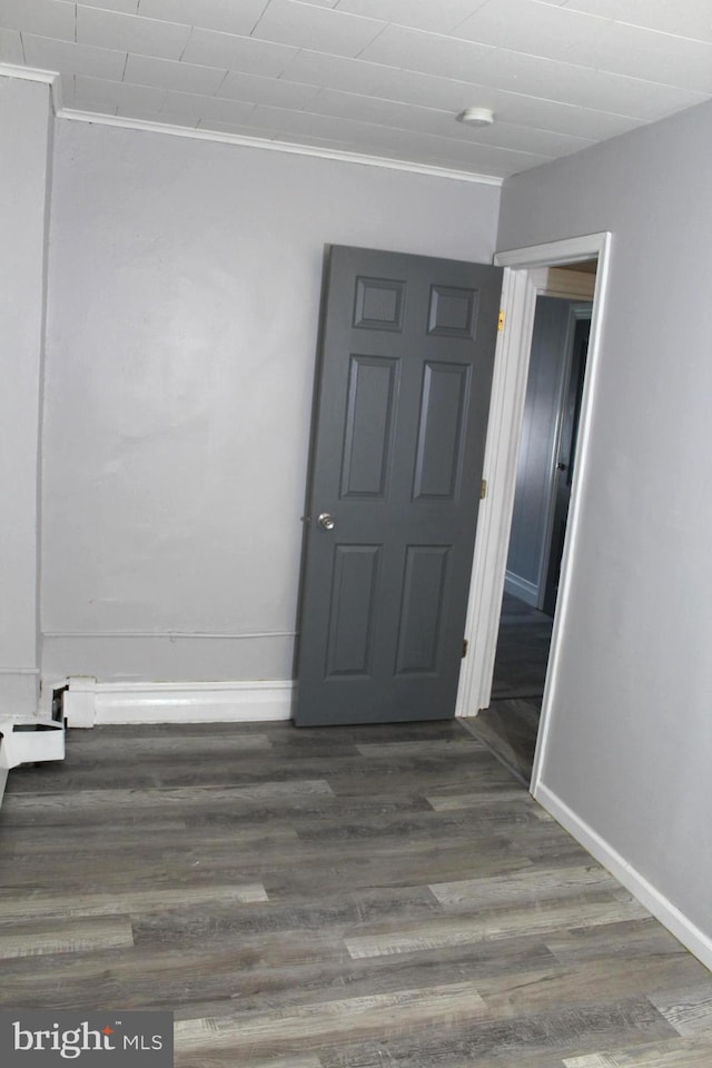 466 N Evans St, Pottstown, PA 19464 - unfurnished room with baseboards, dark wood-style flooring, and crown molding