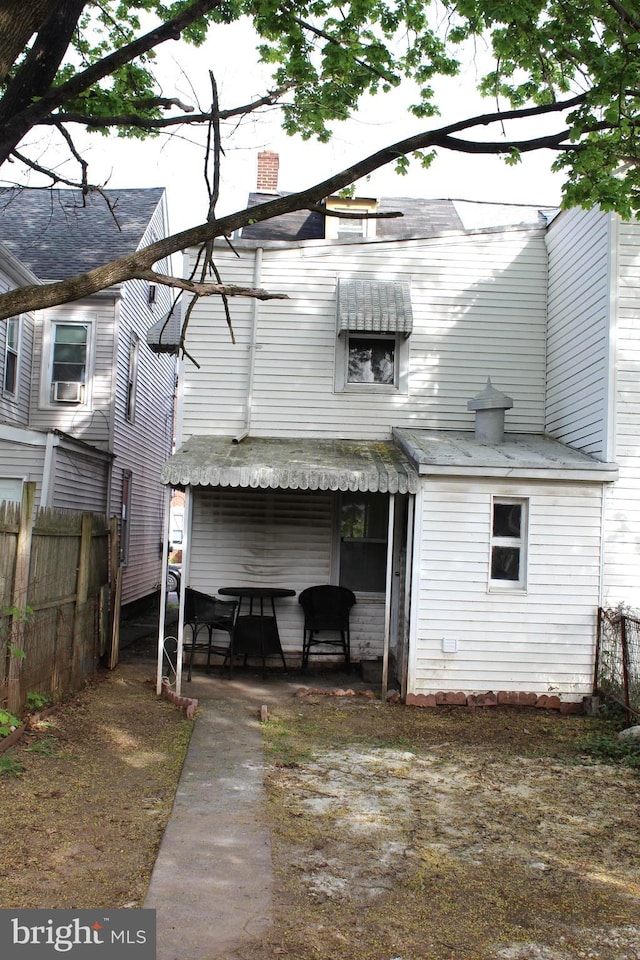 466 N Evans St, Pottstown, PA 19464 - rear view of property with a chimney, a patio area, and fence