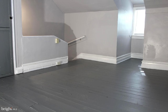 466 N Evans St, Pottstown, PA 19464 - unfurnished living room with baseboards, vaulted ceiling, and wood-type flooring