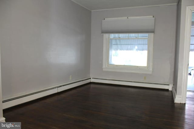 466 N Evans St, Pottstown, PA 19464 - unfurnished room featuring baseboards, ornamental molding, a baseboard heating unit, and dark wood-type flooring