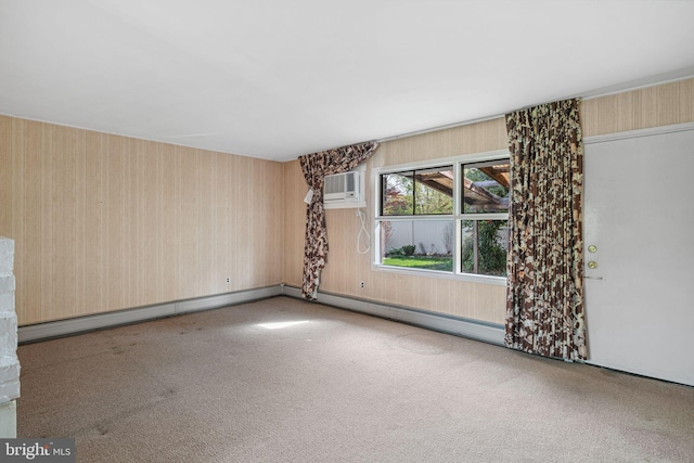 carpeted empty room with a baseboard radiator, a wall mounted AC, and wallpapered walls